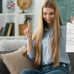 Balancing IELTS Preparation with Daily Life: Study Plans and Tips Woman sitting on couch holding a clipboard with notes.
